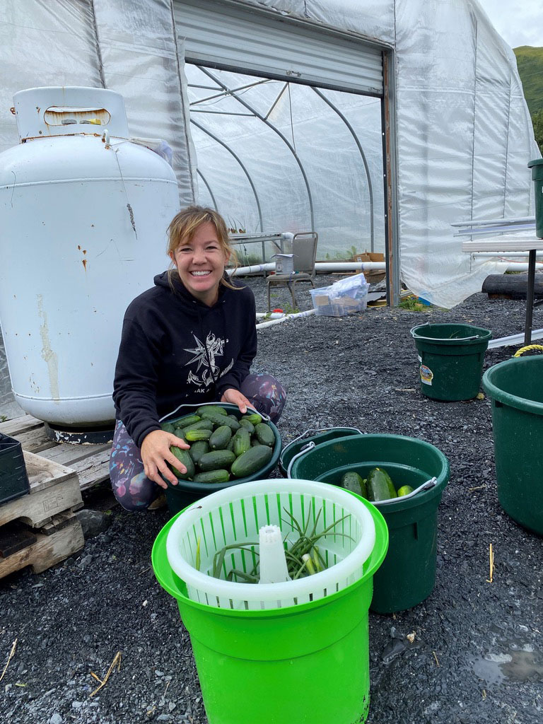 Cynthia Berns with lots of cucumbers